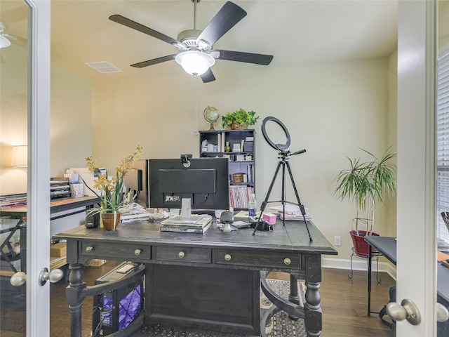 home office featuring dark hardwood / wood-style flooring and ceiling fan