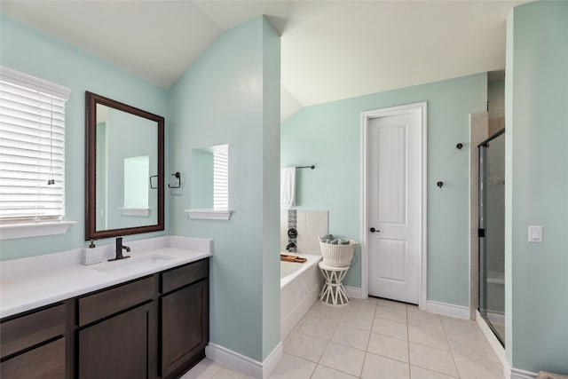 bathroom featuring vanity, tile patterned floors, a healthy amount of sunlight, and separate shower and tub