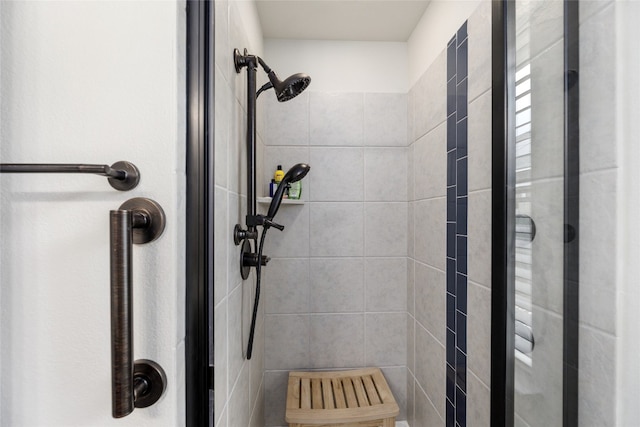 bathroom with a tile shower