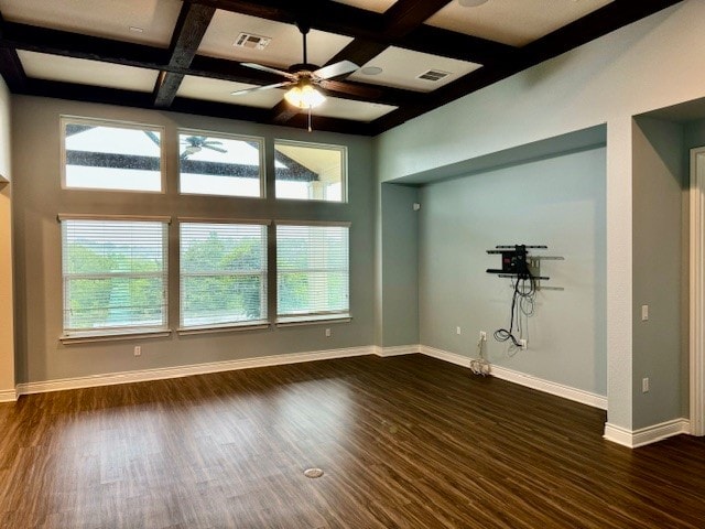 spare room with plenty of natural light, dark hardwood / wood-style floors, and coffered ceiling