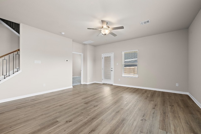 empty room featuring ceiling fan and hardwood / wood-style flooring