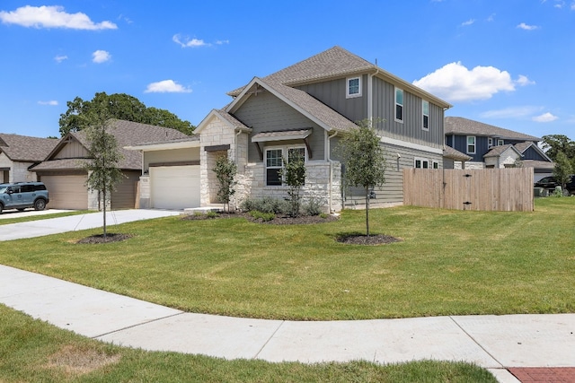 view of front of property with a garage and a front yard