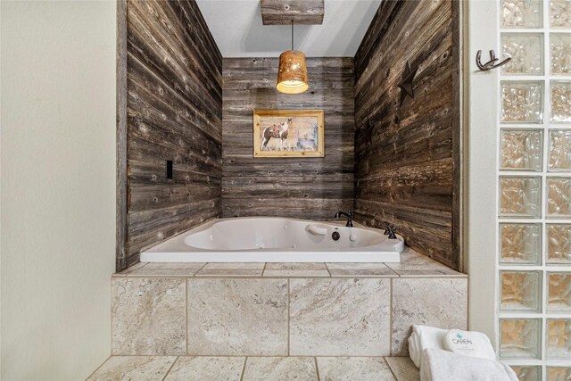 bathroom featuring a relaxing tiled tub