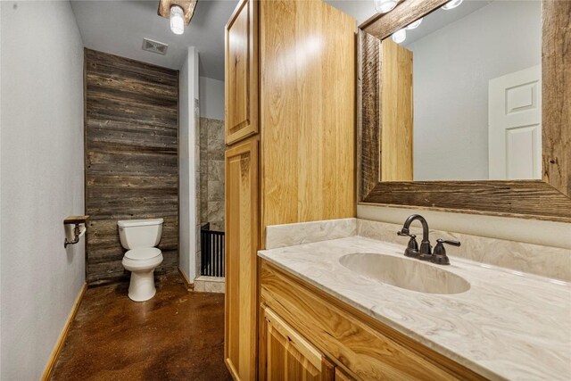 bathroom with vanity and toilet