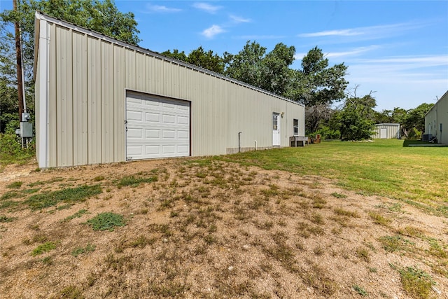 garage with a lawn