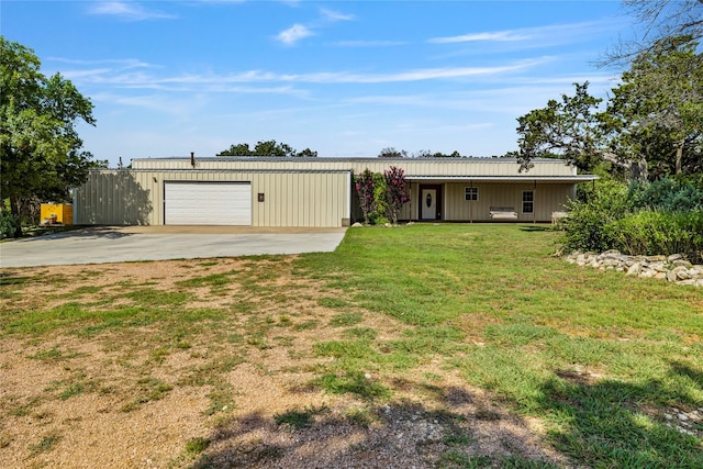 view of front facade featuring a garage and a front lawn