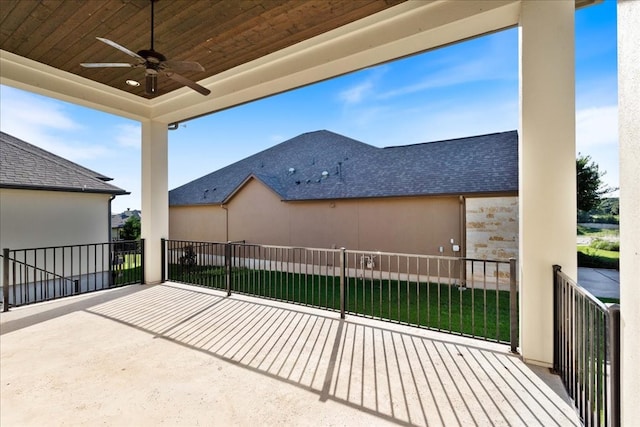 view of patio / terrace with a balcony and ceiling fan