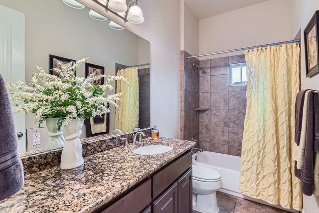 full bathroom featuring toilet, tile patterned flooring, shower / tub combo, and vanity