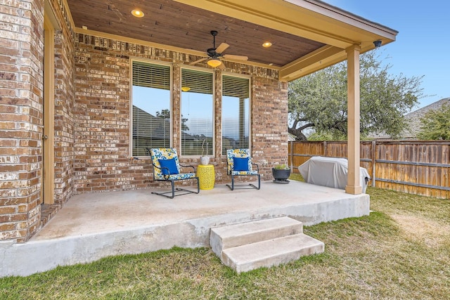 view of patio featuring ceiling fan