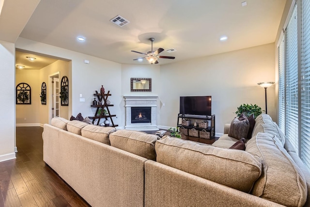 living room with ceiling fan and dark hardwood / wood-style floors