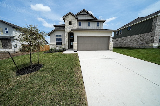 craftsman house featuring a front yard and a garage