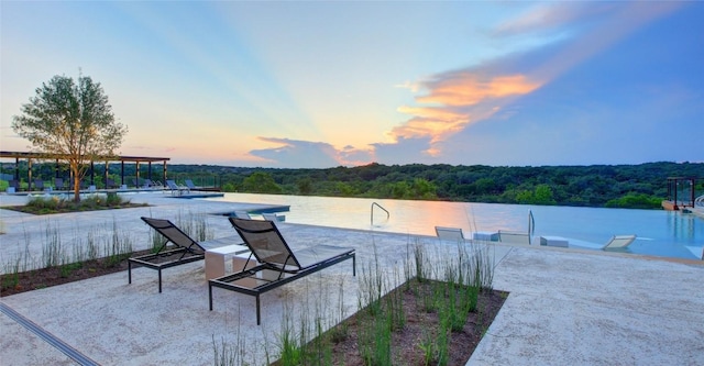 patio terrace at dusk with a water view