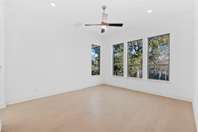 unfurnished room with light hardwood / wood-style flooring and ceiling fan