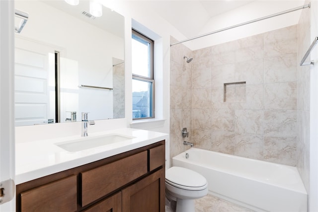 full bathroom with vanity, toilet, and tiled shower / bath combo