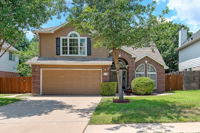 view of front of property with a garage and a front lawn