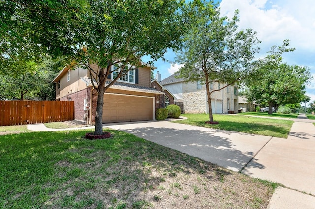 view of front of home featuring a front yard and a garage