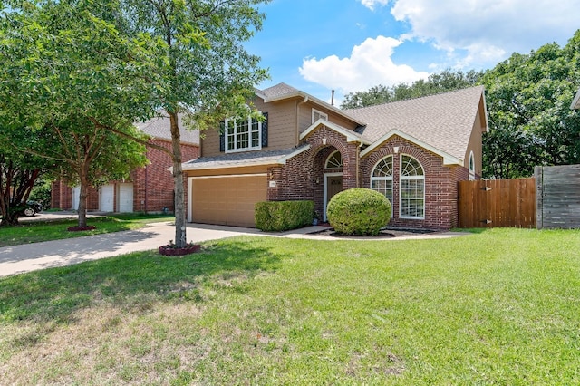 view of property with a front lawn and a garage