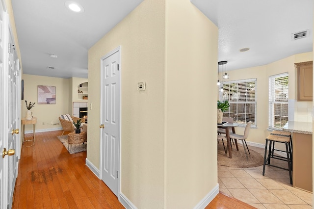 hallway featuring light tile patterned flooring