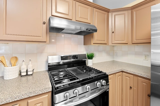 kitchen featuring light brown cabinets, backsplash, and stainless steel appliances