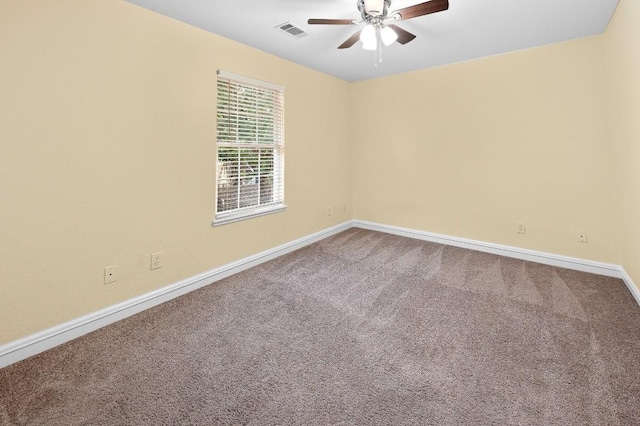 carpeted empty room featuring ceiling fan