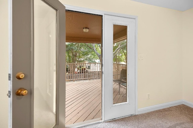 doorway to outside with carpet