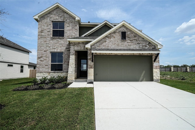 view of front facade with a front yard and a garage