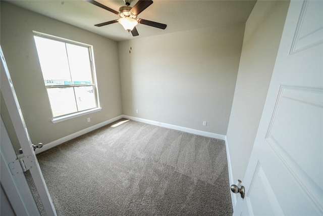 unfurnished room with carpet flooring and ceiling fan