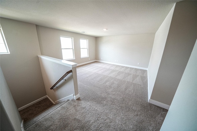 empty room featuring carpet flooring