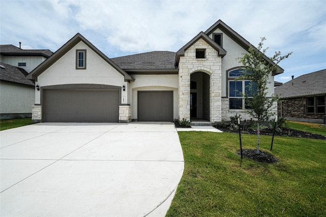 french country style house with a garage and a front yard