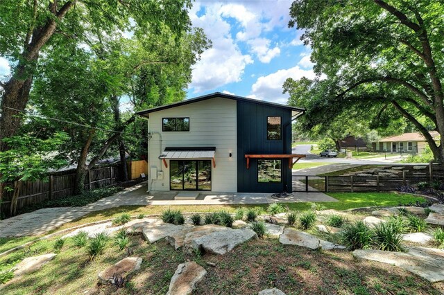 back of property with a patio area