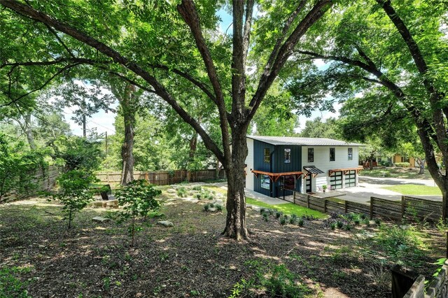 3104 Santa Monica Dr, Austin, TX 78741 - fenced backyard featuring an attached garage