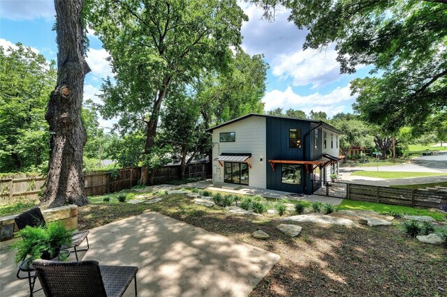 3104 Santa Monica Dr, Austin, TX 78741 - back of house featuring a fenced backyard and a patio area