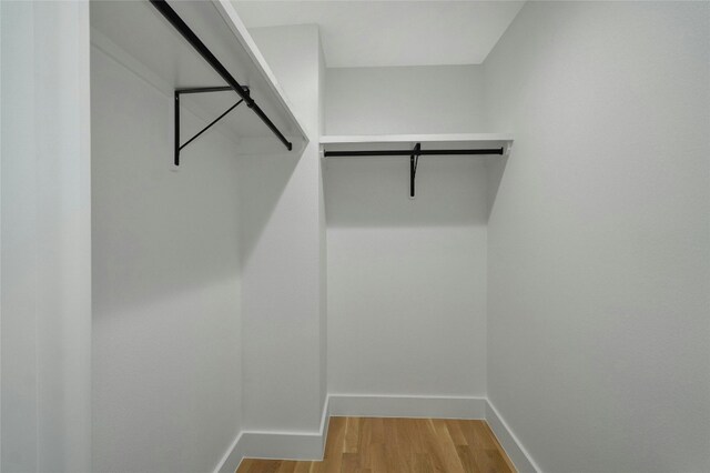 walk in closet featuring light hardwood / wood-style floors