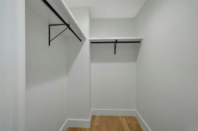 walk in closet featuring light wood-style floors