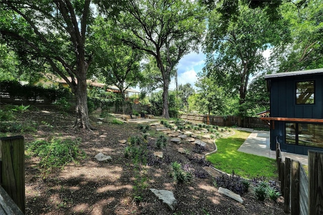 view of yard with a patio and a fenced backyard