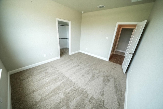 213 Fillmore Fls, Cibolo, TX 78108 - unfurnished bedroom with carpet, a walk in closet, baseboards, and a closet