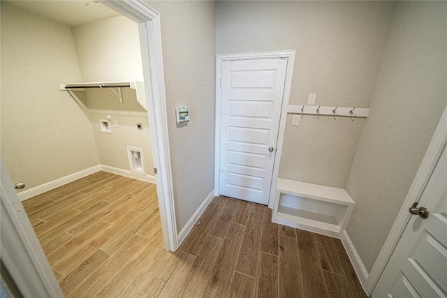 washroom with wood finish floors, washer hookup, electric dryer hookup, laundry area, and baseboards