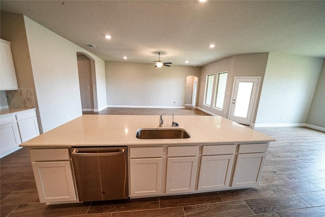 213 Fillmore Fls, Cibolo, TX 78108 - kitchen with dishwasher, arched walkways, a sink, open floor plan, and a ceiling fan