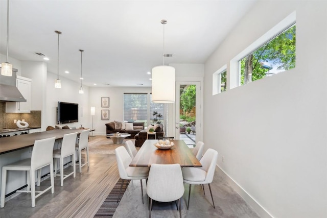 dining space with baseboards, visible vents, and recessed lighting