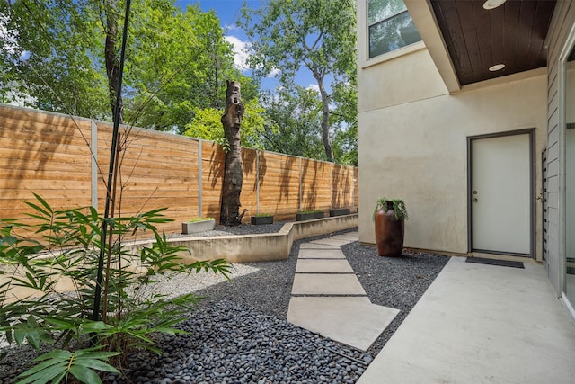 view of yard with a fenced backyard