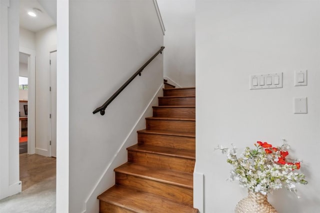 stairway featuring concrete floors