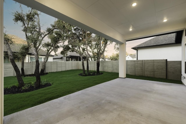 patio terrace at dusk with a yard