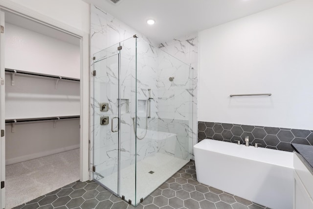 bathroom with plus walk in shower and tile patterned flooring