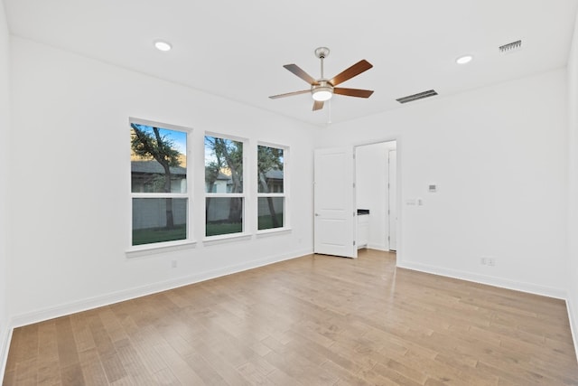 unfurnished room featuring ceiling fan and light hardwood / wood-style flooring