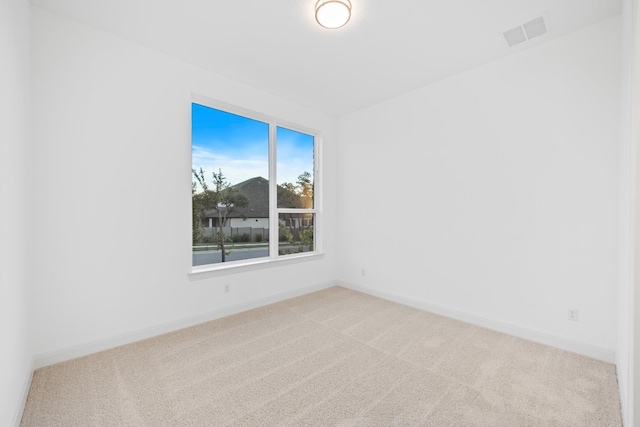 unfurnished room with carpet flooring