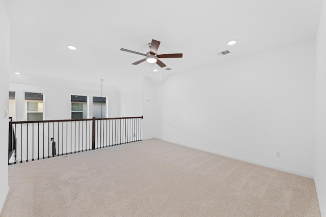 unfurnished room with ceiling fan and light colored carpet