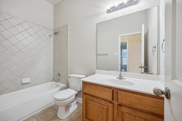 full bathroom featuring tile patterned flooring, vanity, tiled shower / bath combo, and toilet