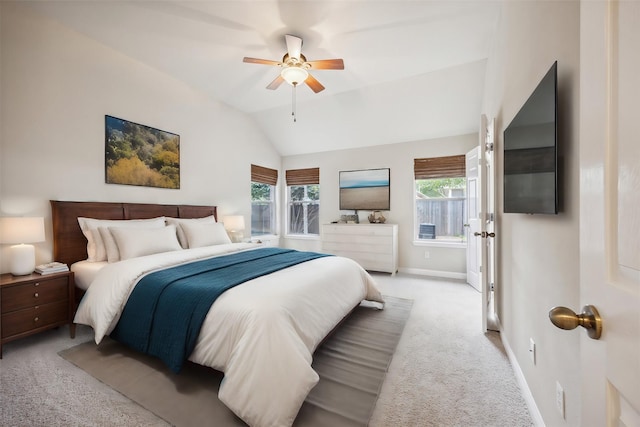 bedroom featuring ceiling fan, light colored carpet, and lofted ceiling