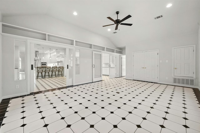 unfurnished living room with lofted ceiling and ceiling fan