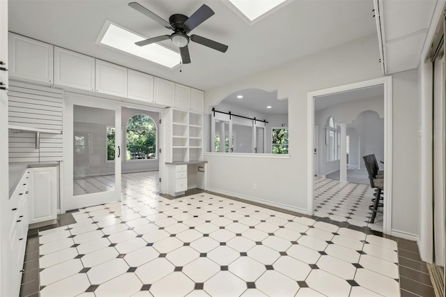 bathroom with french doors and ceiling fan